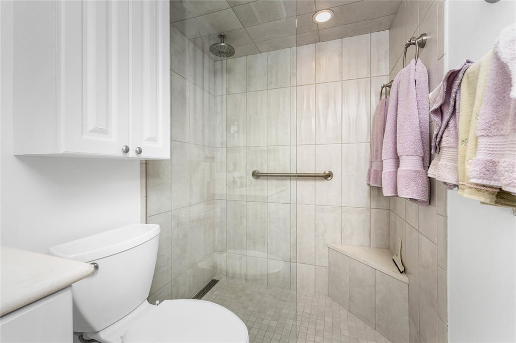 1551 Beach Road, Unit 204 Englewood, FL 34223 - Photo 24 of 55 a white toilet sitting next to a bathroom sink