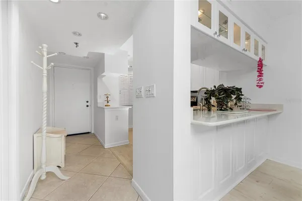 a view of kitchen with refrigerator and window