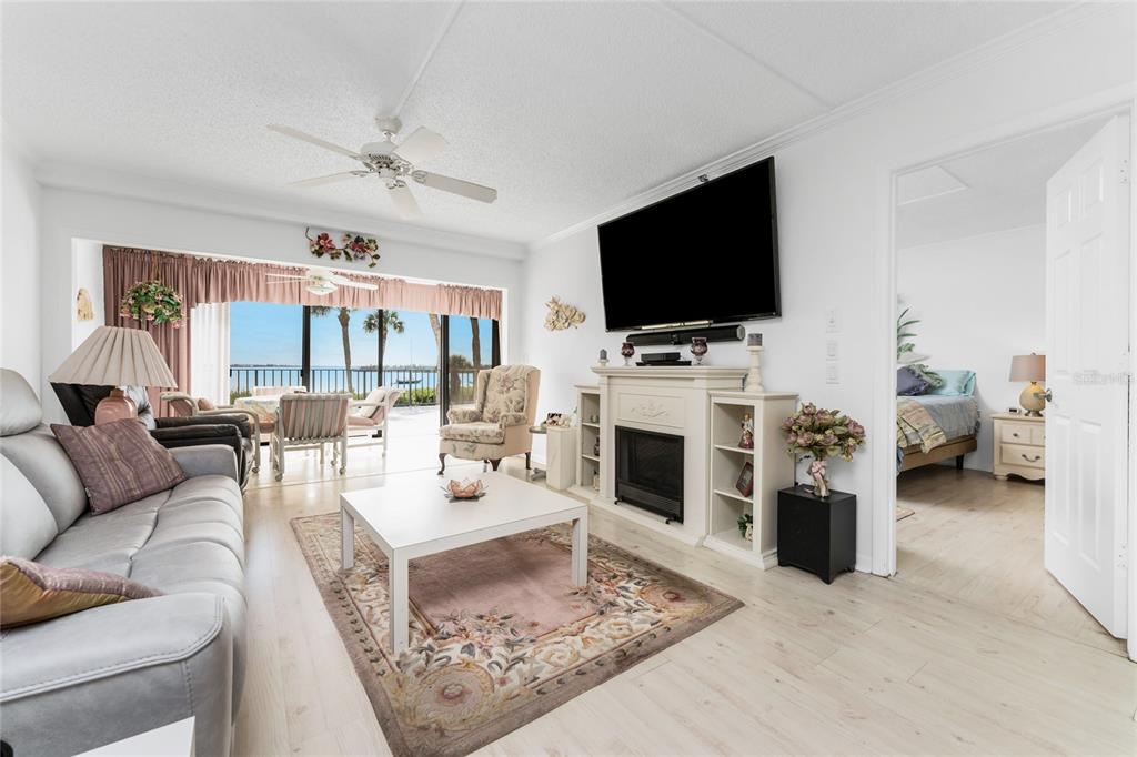 1551 Beach Road, Unit 204 Englewood, FL 34223 - Photo 9 of 55 a living room with furniture and a flat screen tv