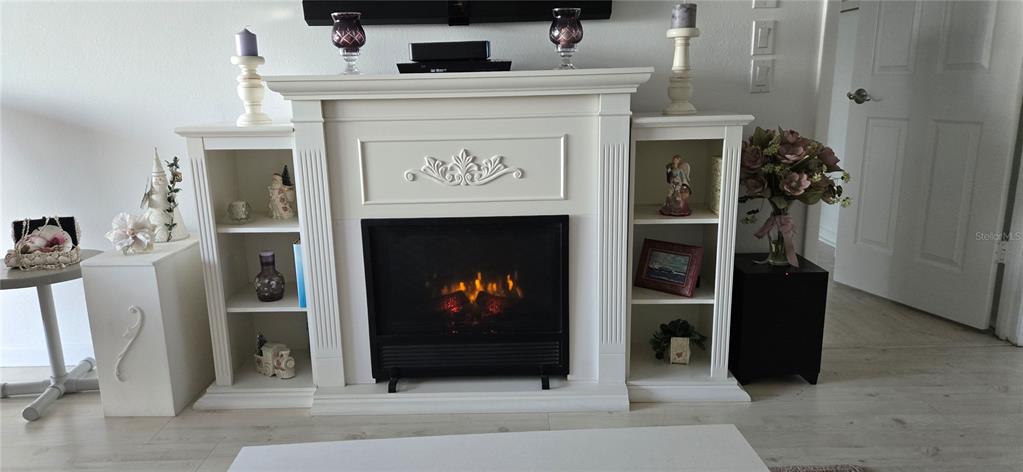 1551 Beach Road, Unit 204 Englewood, FL 34223 - Photo 10 of 55 a living room with furniture and a fireplace