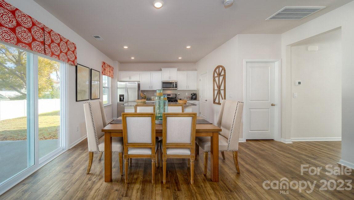 111 Wheatfield Road Fletcher, NC 28732 - Photo 11 of 36 a view of a dining room with furniture window and wooden floor