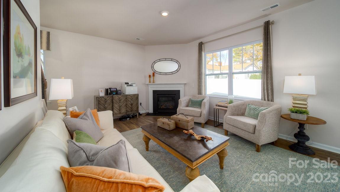 111 Wheatfield Road Fletcher, NC 28732 - Photo 13 of 36 a living room with furniture a fireplace and a large window