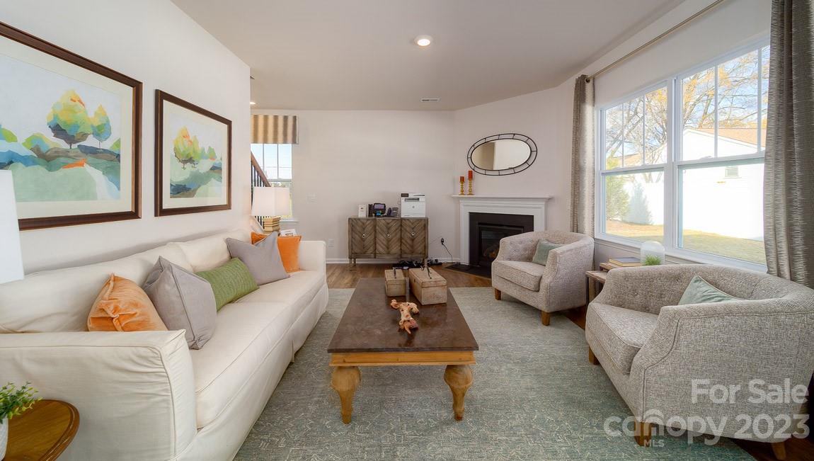111 Wheatfield Road Fletcher, NC 28732 - Photo 14 of 36 a living room with furniture fireplace and a large window