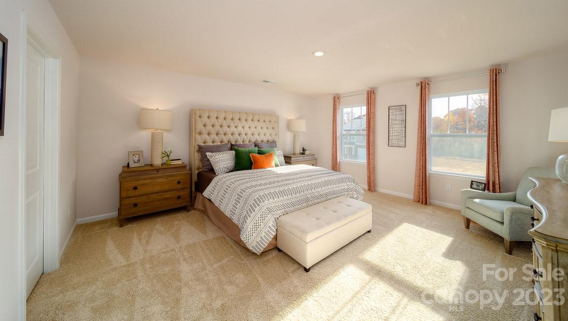 111 Wheatfield Road Fletcher, NC 28732 - Photo 19 of 36 a bedroom with a bed and wooden floor