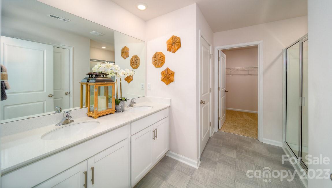 111 Wheatfield Road Fletcher, NC 28732 - Photo 23 of 36 a bathroom with a double vanity sink mirror and shower