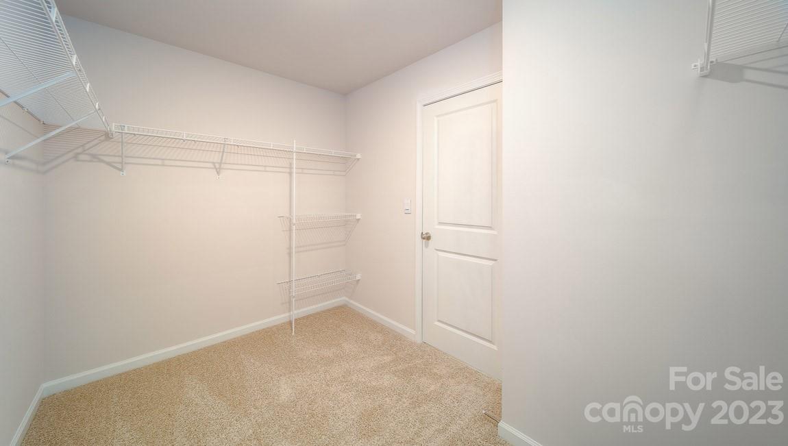 111 Wheatfield Road Fletcher, NC 28732 - Photo 25 of 36 a view of a room with racks on the wall