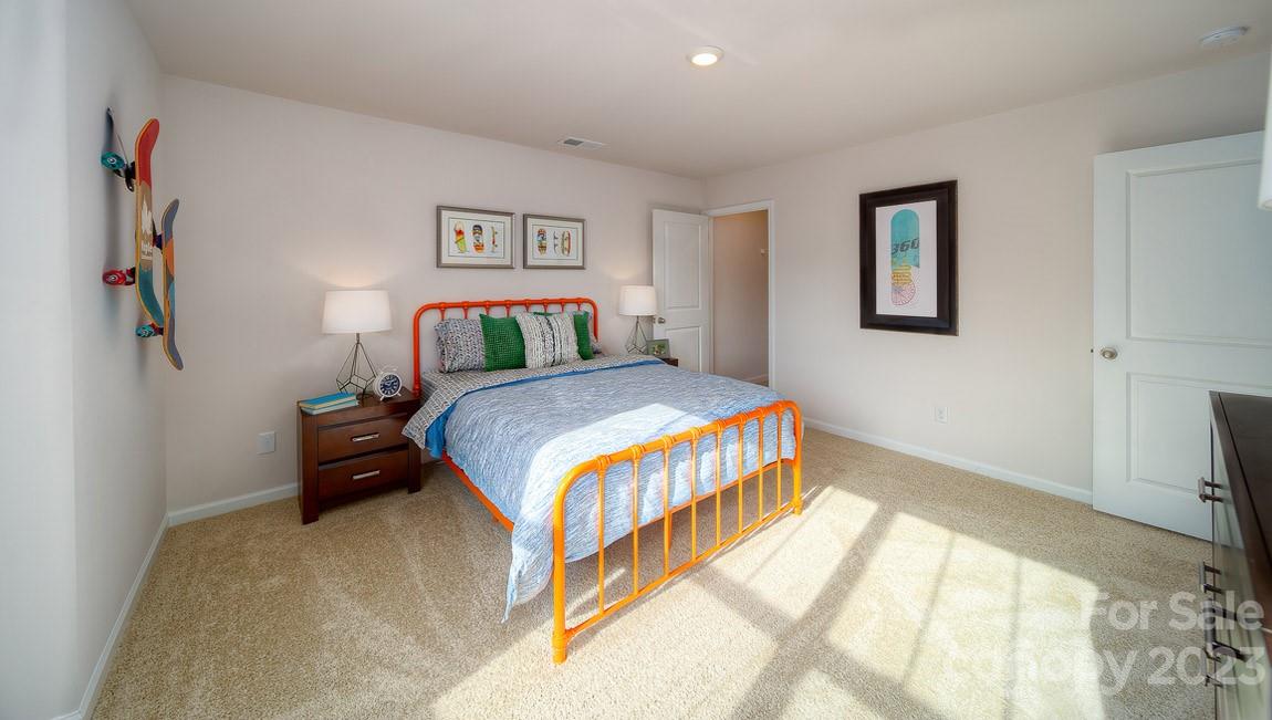 111 Wheatfield Road Fletcher, NC 28732 - Photo 28 of 36 a bedroom with a bed and a flat screen tv