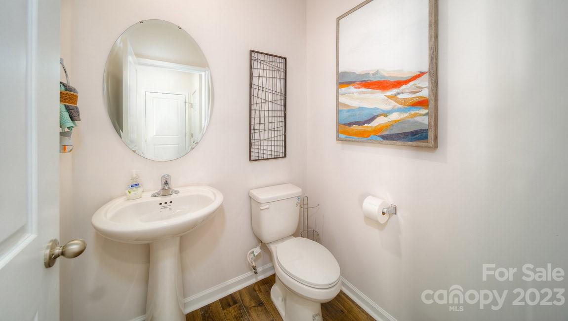 111 Wheatfield Road Fletcher, NC 28732 - Photo 5 of 36 a bathroom with a toilet a sink and mirror