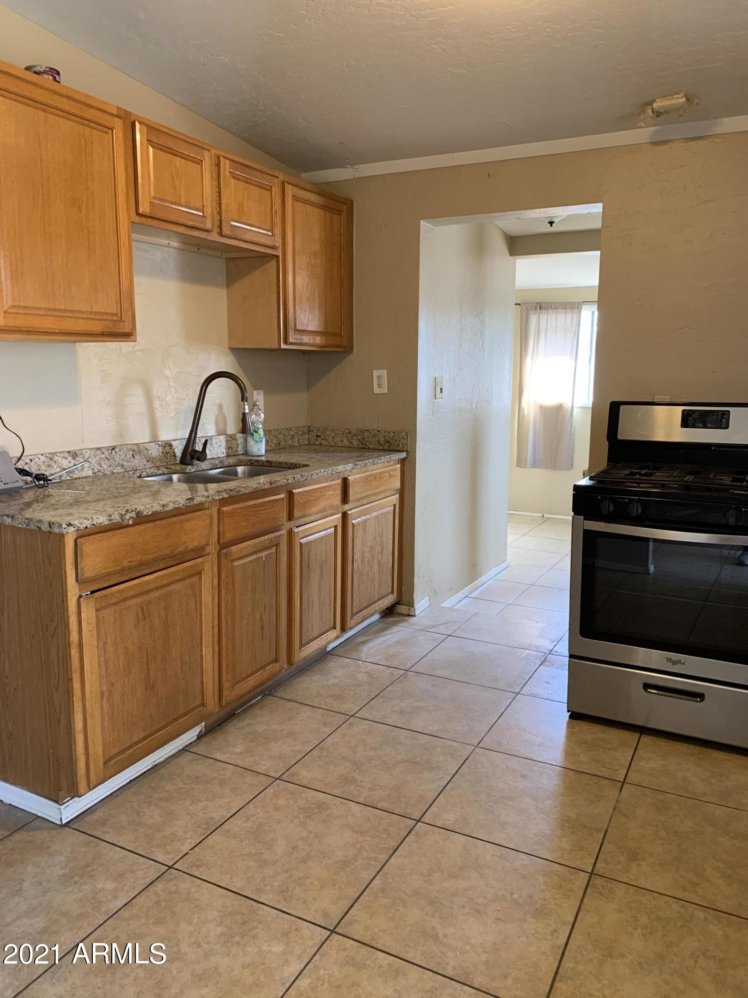 3758 West Romley Road Phoenix, AZ 85041 - Photo 11 of 13 IMG-3501