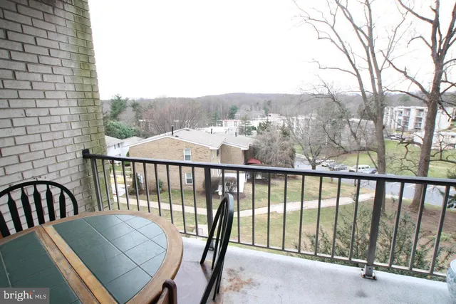 a view of a balcony with furniture