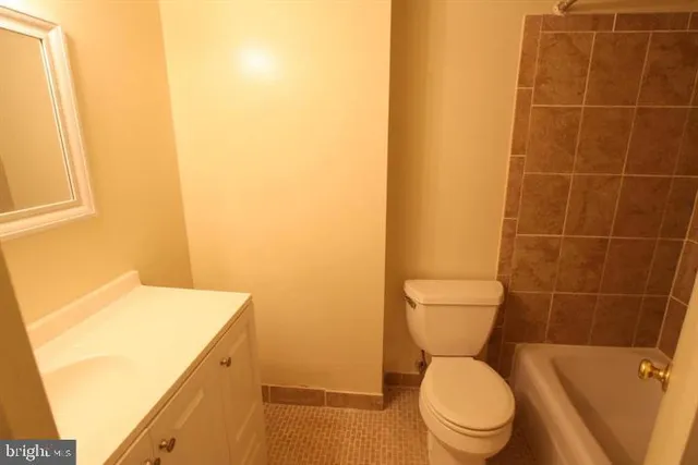 a bathroom with a toilet and a sink