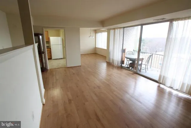 a view of an entryway with wooden floor