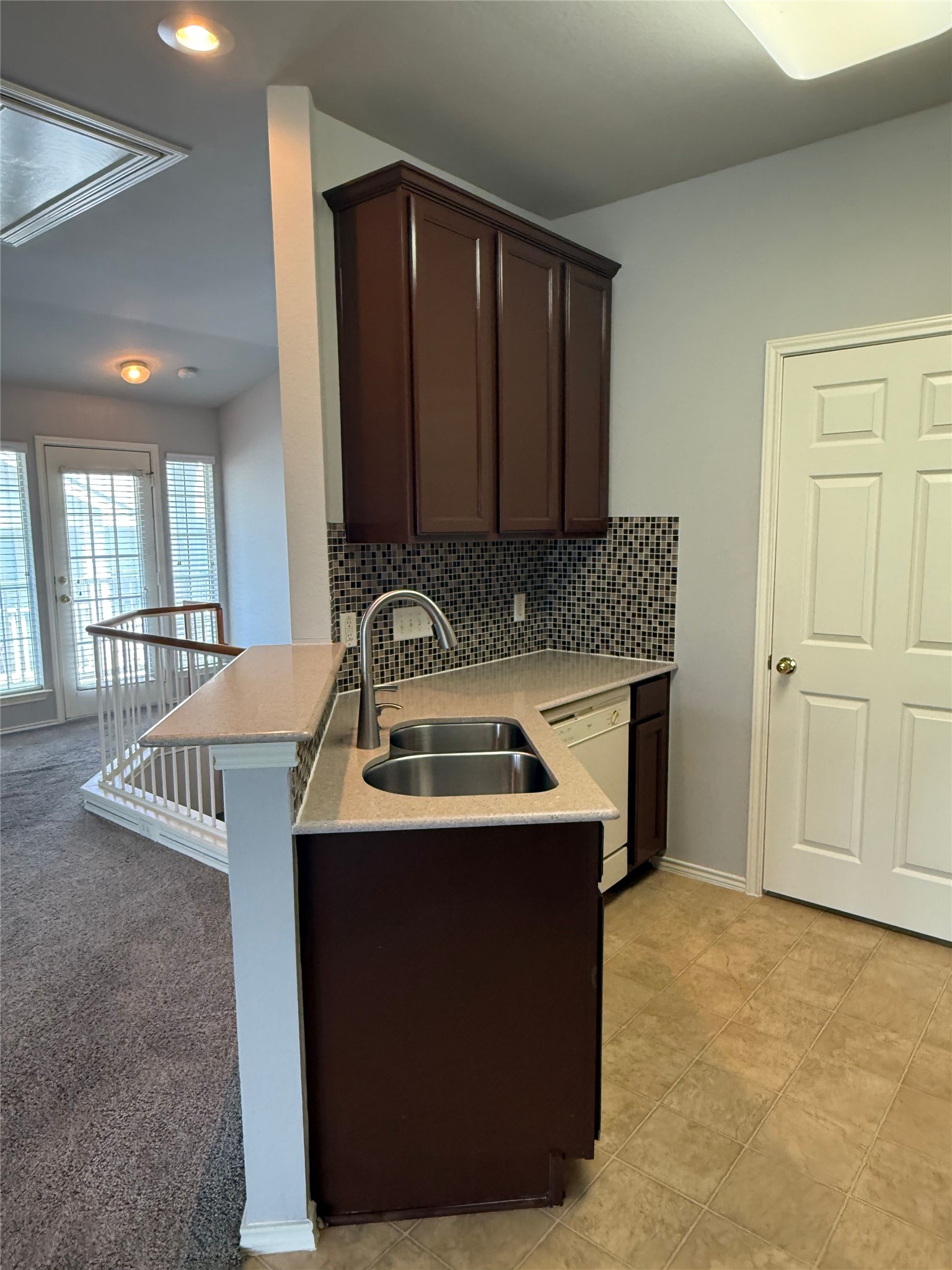 1900 Scofield Ridge Parkway, Unit 4701 Austin, TX 78727 - Photo 3 of 27 A compact kitchen with sleek counters and a modern backsplash, perfect for entertaining.