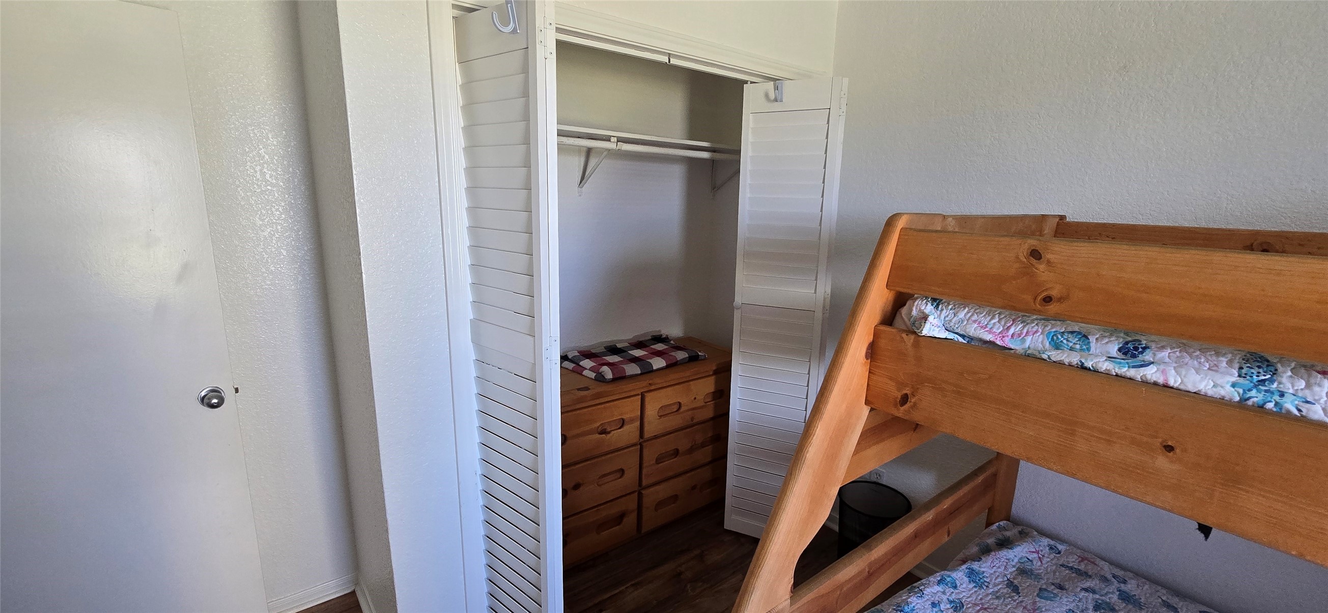 16506 Blackbeard Road, Unit E Jamaica Beach, TX 77554 - Photo 6 of 10 a view of walk in closet with clothes and shoes