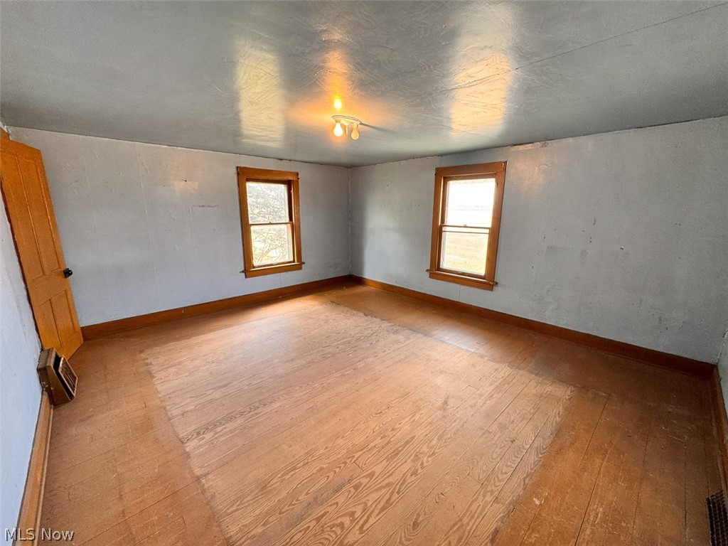 15 Glecoe Road Southwest Carrollton, OH 44615 - Photo 49 of 50 Empty room with light wood-style flooring and baseboards