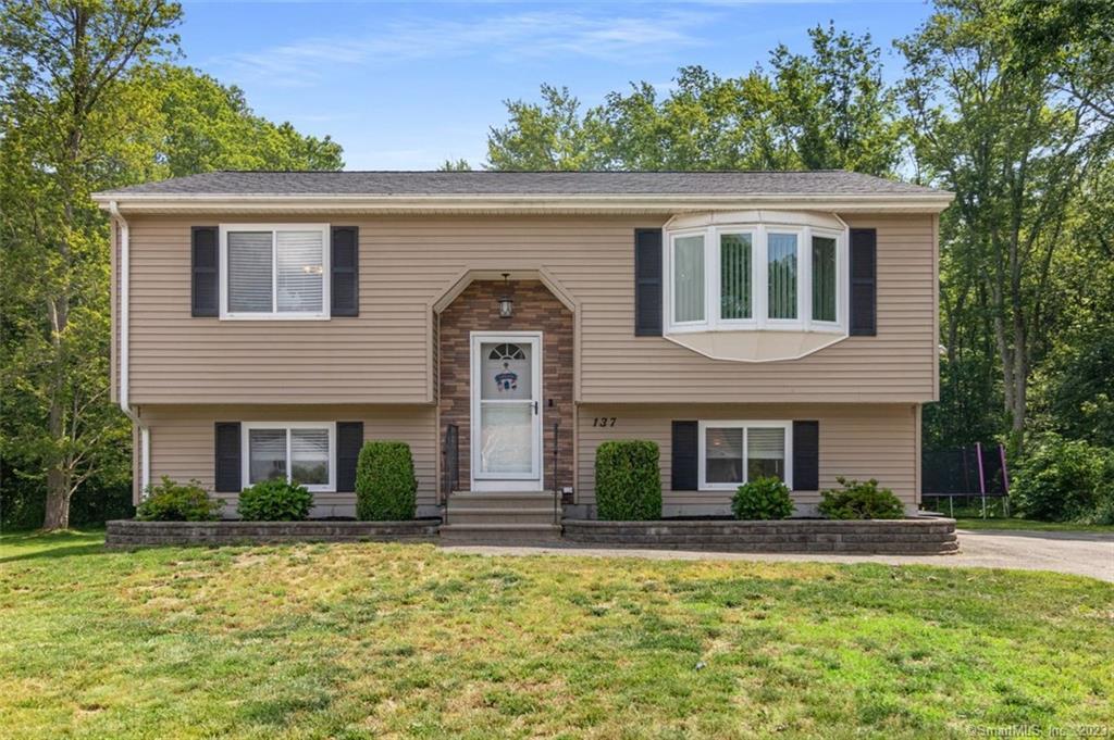 137 Colonial Road Plainfield, CT 06374 - Photo 1 of 1 a front view of a house with a yard