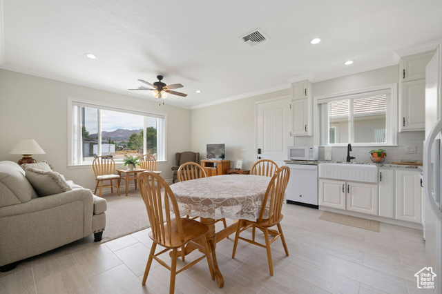 230 Boulder Way Leeds, UT 84746 - Photo 29 of 72 ADU Dining space with ornamental molding, ceiling fan, and recessed lighting, full kitchen with convection oven, microwave, farm sink, dishwasher, tile / carpet flooring.