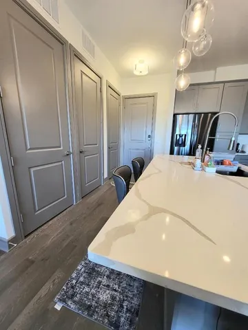 a very nice looking bedroom with wooden floor