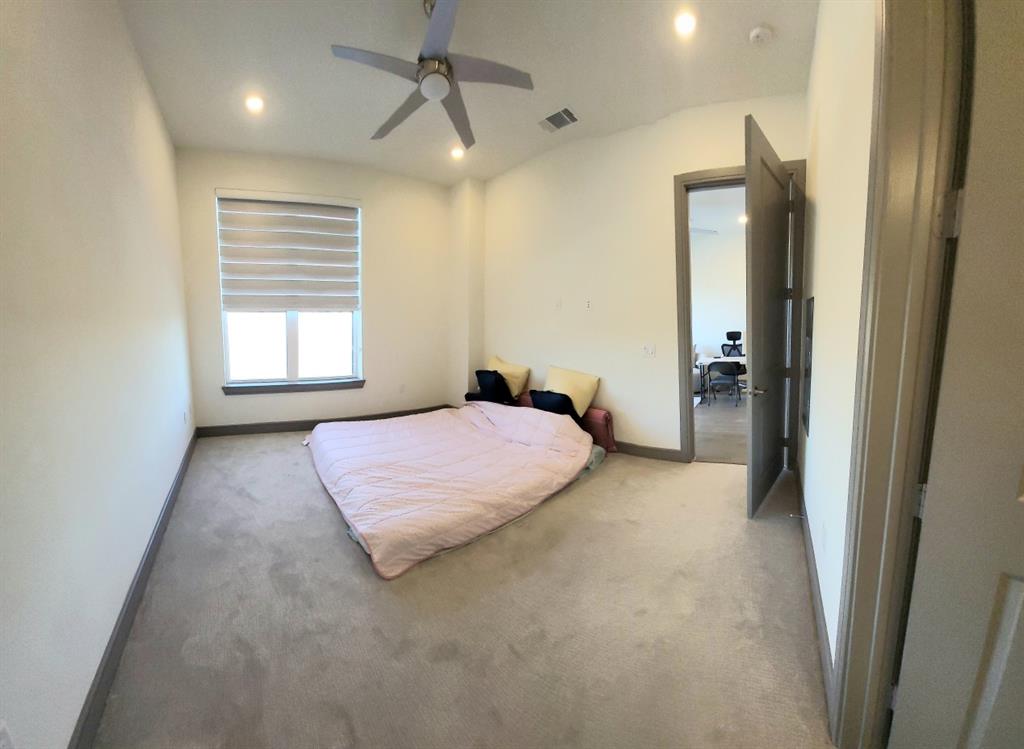 2700 Old Denton Road, Unit 3314 Carrollton, TX 75007 - Photo 14 of 18 a bedroom with a bed and a window