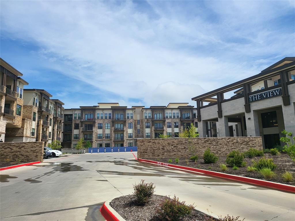 2700 Old Denton Road, Unit 3314 Carrollton, TX 75007 - Photo 15 of 18 a view of a building and a street