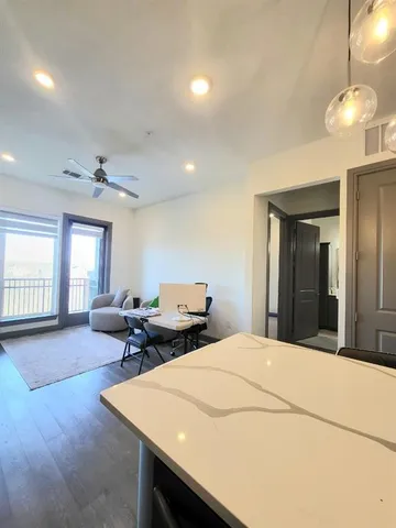 a bed room with a bed mirror and a window