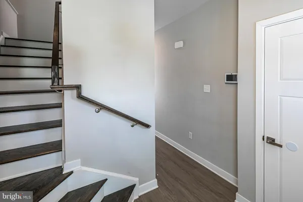 a view of entryway with wooden floor