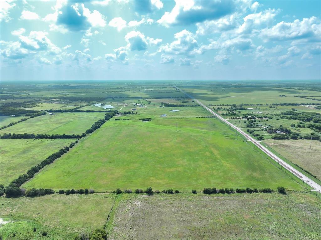 3486 FM 3486, Unit 2 Terrell, TX 75160 - Photo 6 of 14 a view of a field with an trees