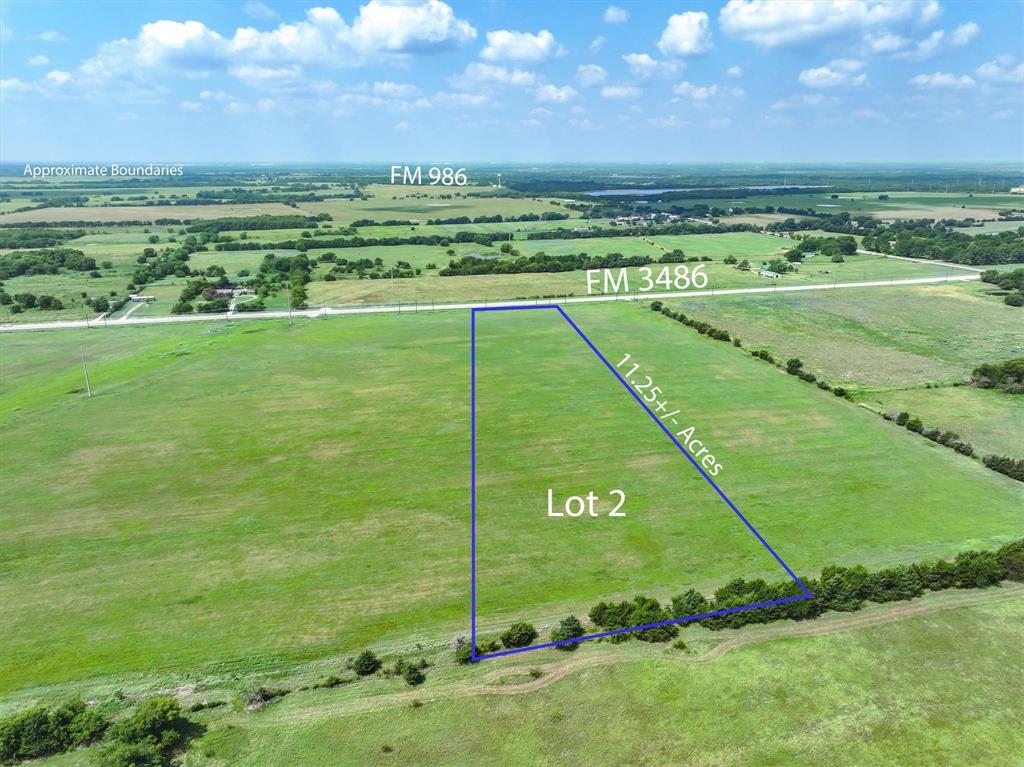 3486 FM 3486, Unit 2 Terrell, TX 75160 - Photo 10 of 14 a view of a field with a big yard
