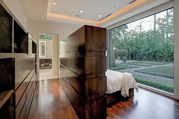 a kitchen with kitchen island a counter top space a sink a refrigerator and a stove