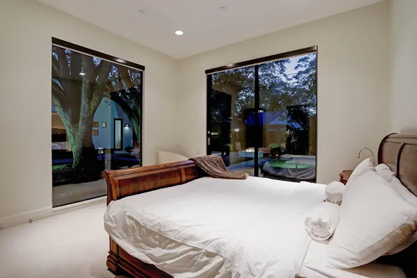 a bathroom with a granite countertop sink a toilet and shower