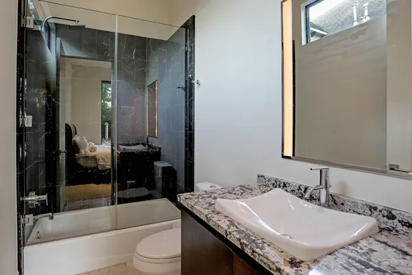 a bedroom with a bed and a couch