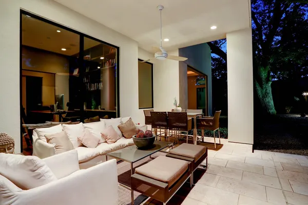 a swimming pool with outdoor seating and yard