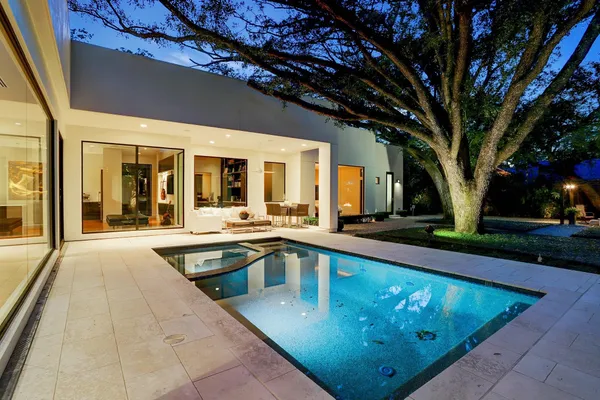 a living room with furniture a large window