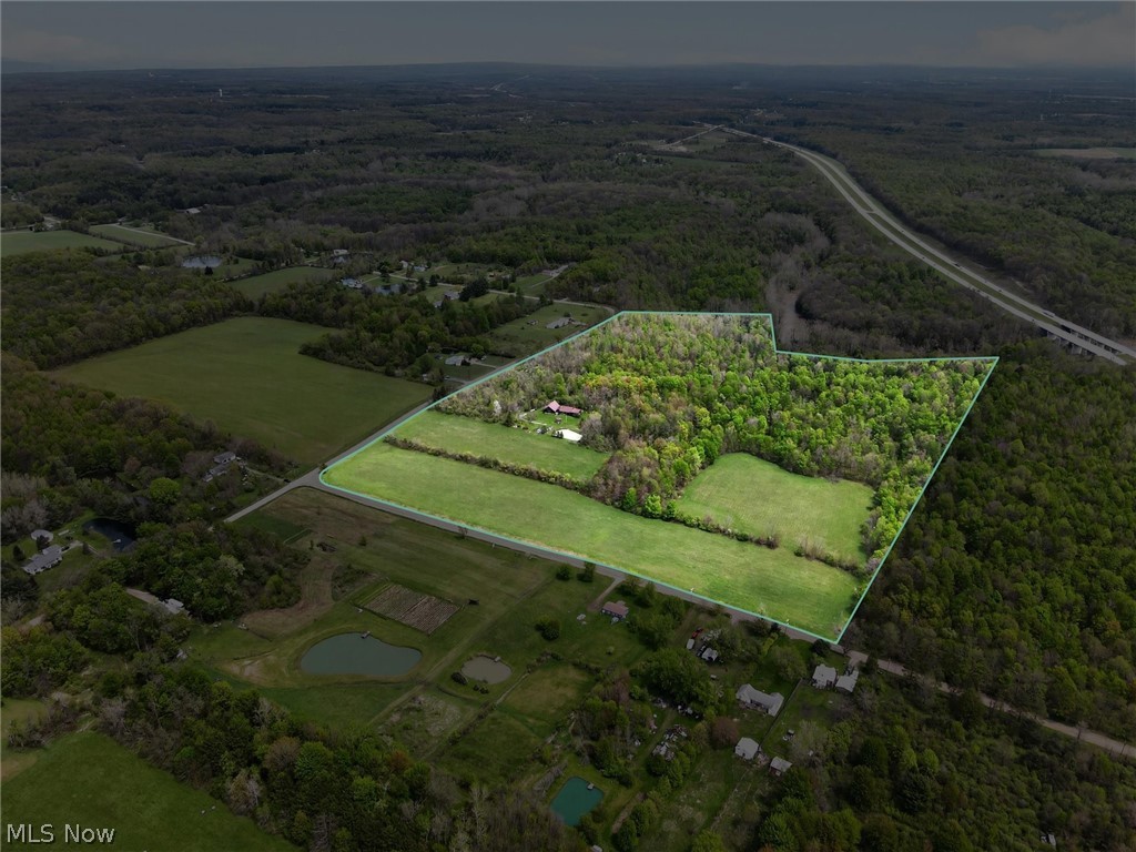 1526 Stevenson Road Ashtabula, OH 44004 - Photo 3 of 50 Expansive land parcel featuring a mix of open fields and mature woodlands