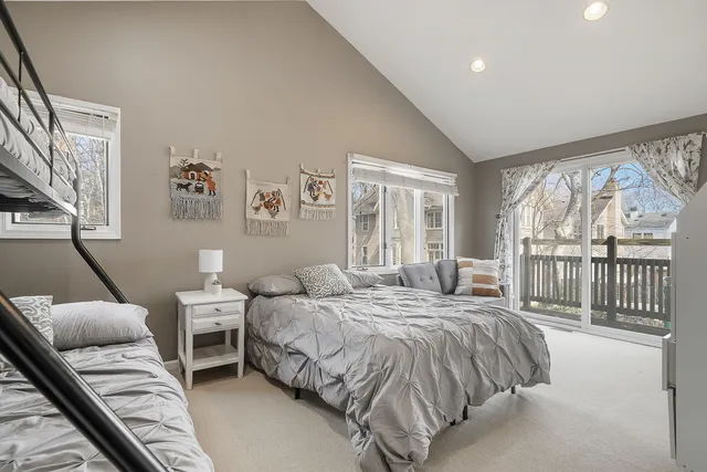 a bed room with a bed and a large window