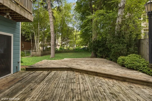 a view of a house with a garage and balcony