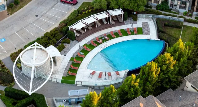 a view of swimming pool with outdoor seating