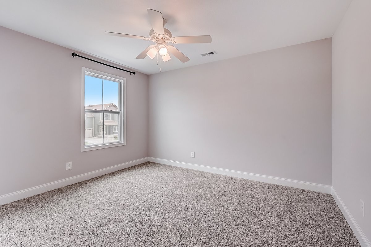414 Andean Court Clarksville, TN 37040 - Photo 15 of 26 an empty room with a chandelier fan