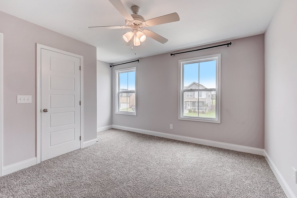 414 Andean Court Clarksville, TN 37040 - Photo 16 of 26 an empty room with windows and fan