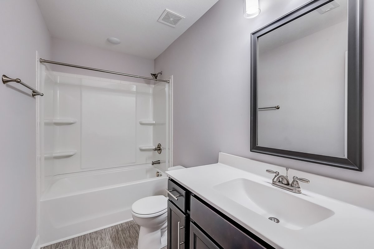 414 Andean Court Clarksville, TN 37040 - Photo 17 of 26 a bathroom with a sink a toilet and a bathtub