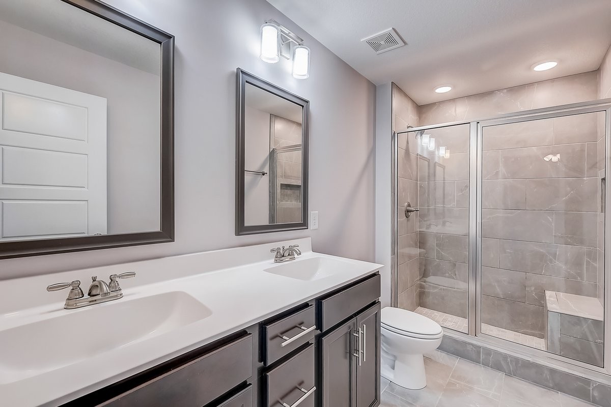 414 Andean Court Clarksville, TN 37040 - Photo 21 of 26 a bathroom with a sink a toilet and shower