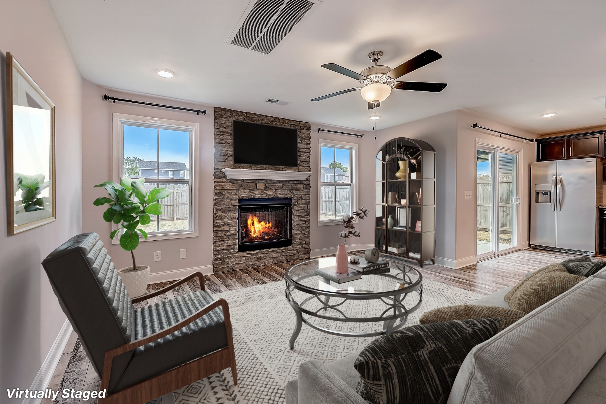 414 Andean Court Clarksville, TN 37040 - Photo 6 of 26 a living room with furniture a fireplace and a flat screen tv