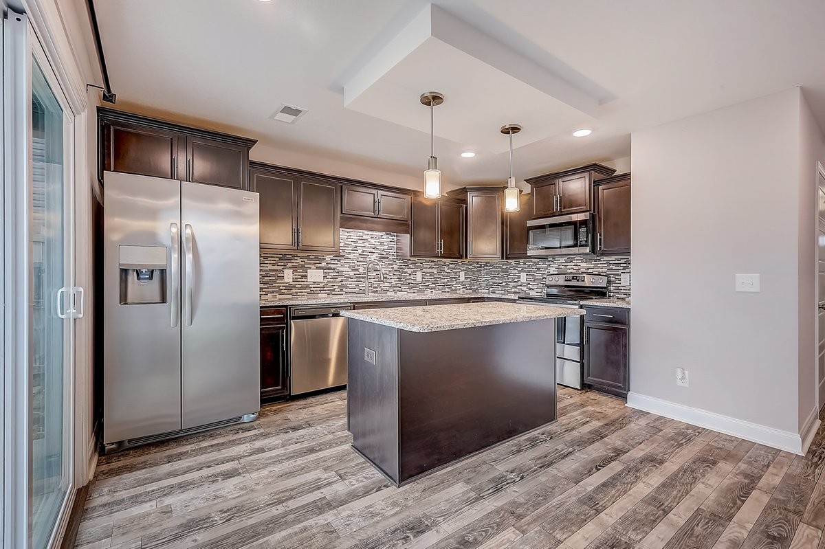414 Andean Court Clarksville, TN 37040 - Photo 8 of 26 a kitchen with stainless steel appliances granite countertop a refrigerator and a sink