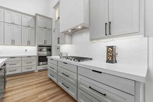 a living room with dining table and a table