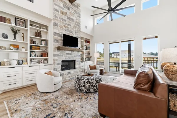 a spacious bedroom with a bed and a table in it