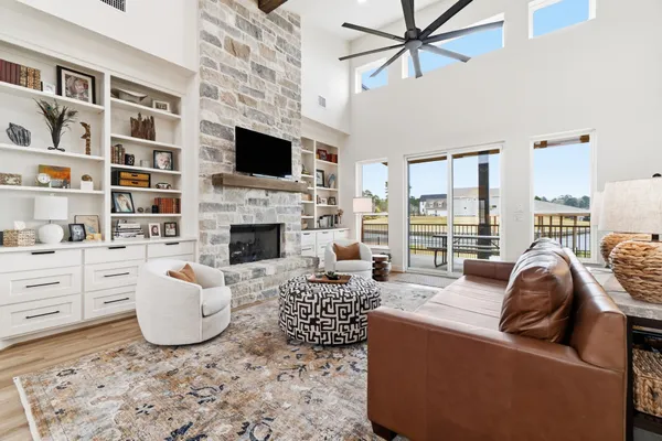 a spacious bedroom with a bed and a table in it