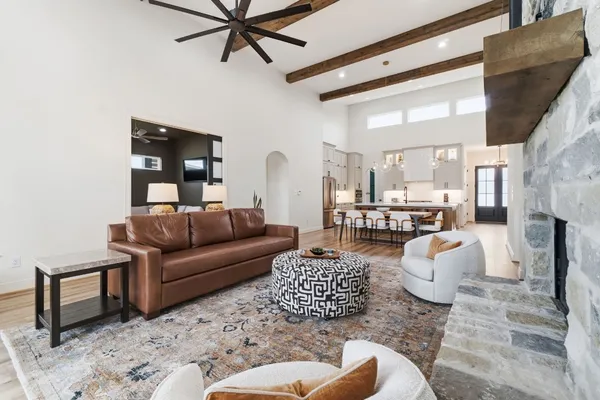 a bedroom with a bed lamp closet and wooden floor