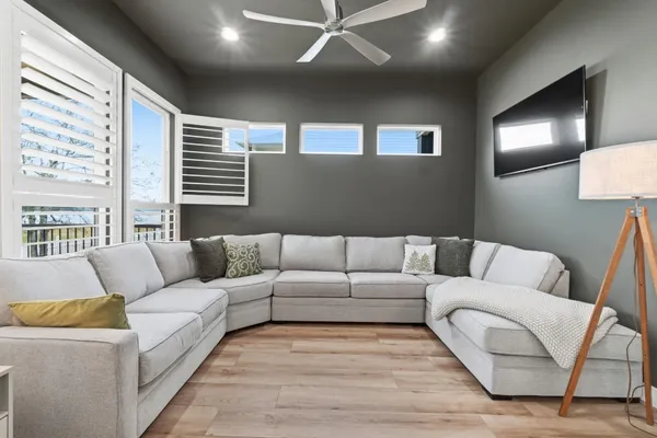 a bedroom with a bed dresser and a window