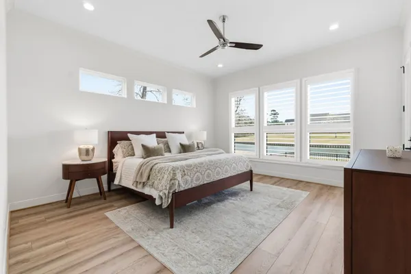 a large bathroom with double vanity and a bathtub