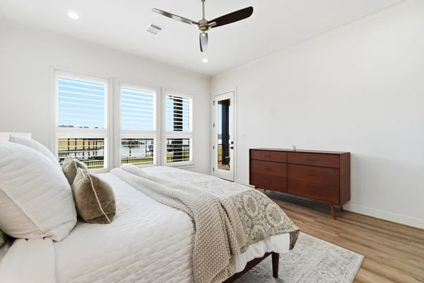 a bedroom with a bed and a table in it